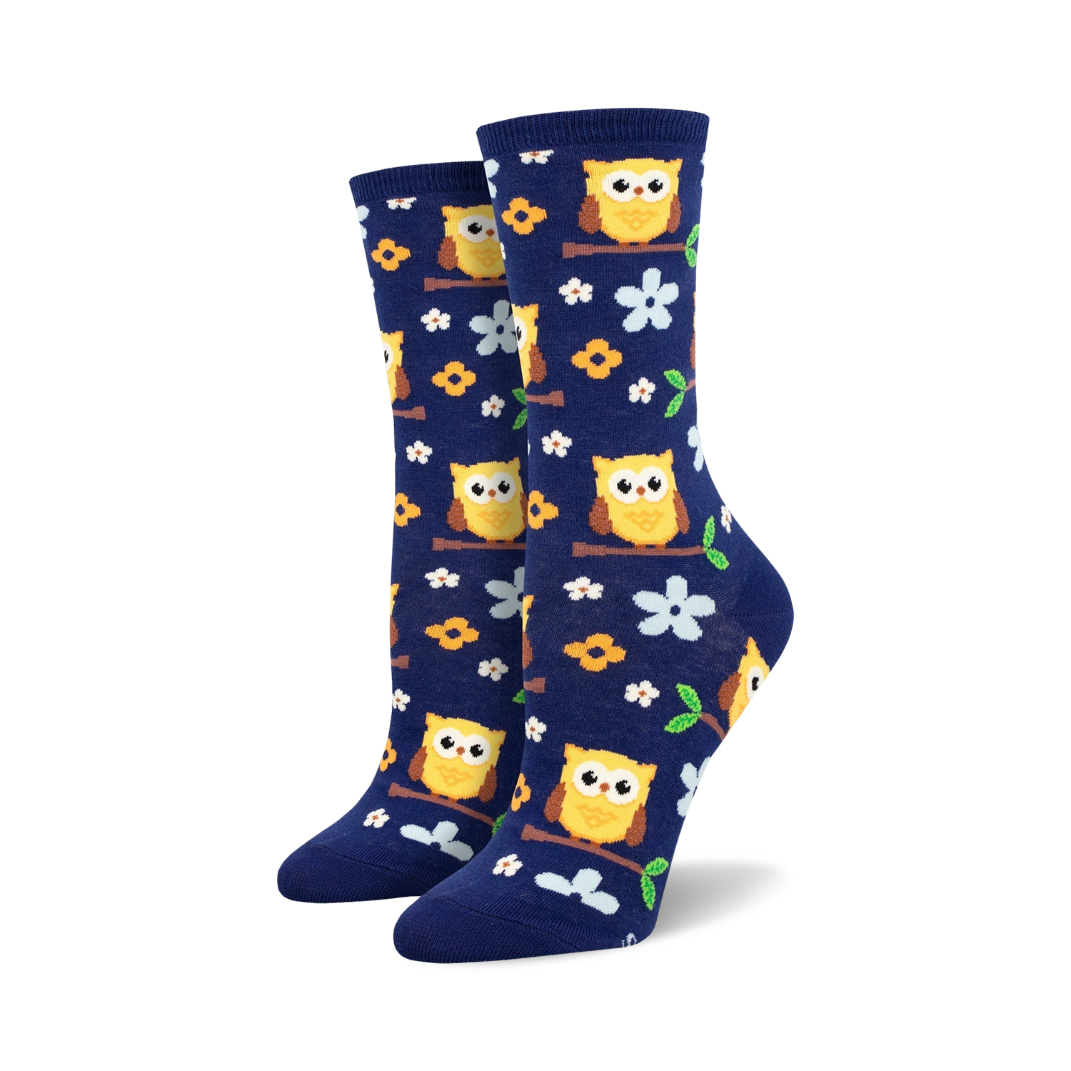 Pair of navy blue crew socks with yellow owls and flowers. Lifestyle shot showing socks with white sneakers.