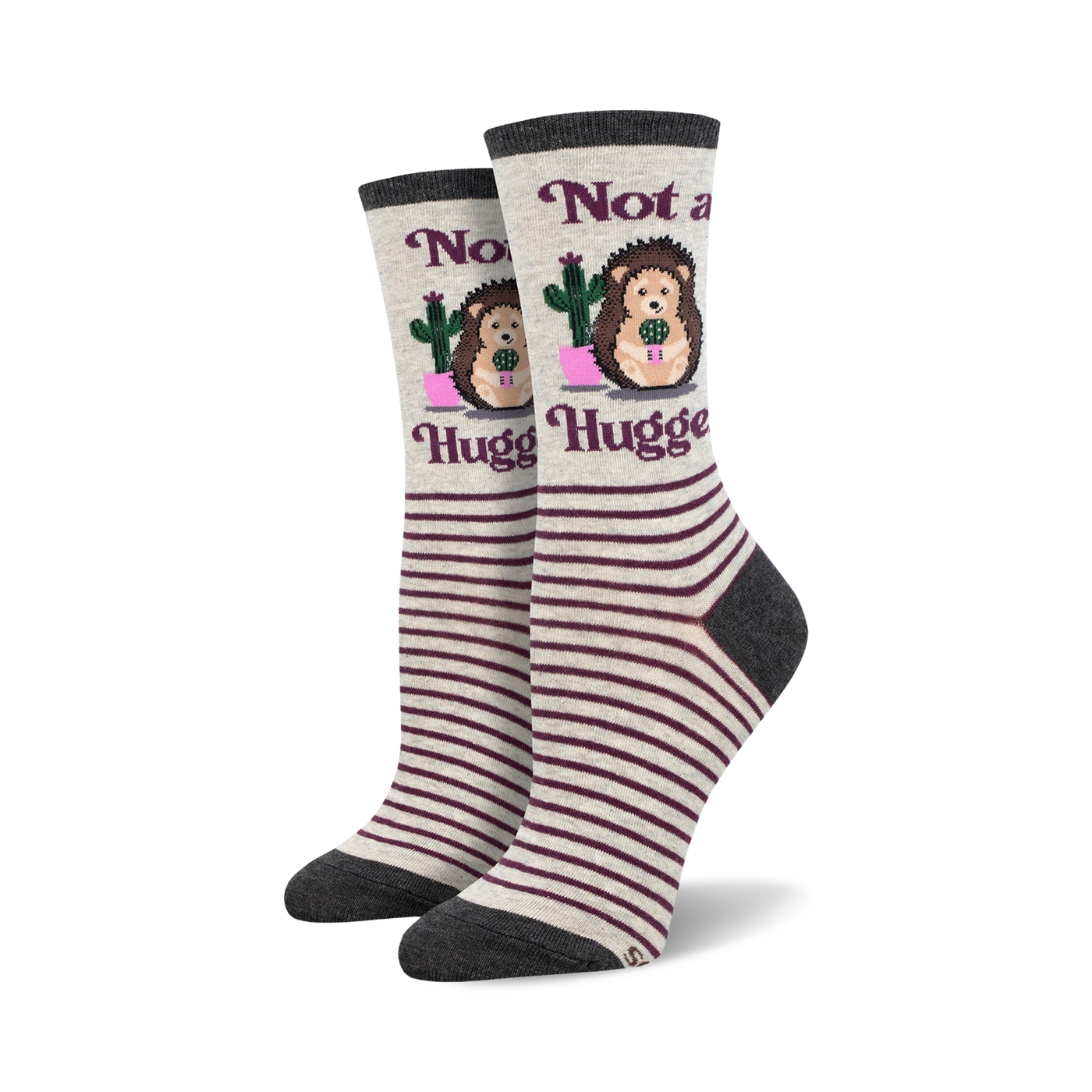 Pair of women's crew socks. Grey and burgundy stripes. Features a hedgehog holding a cactus and the text 'Not a Hugger'.