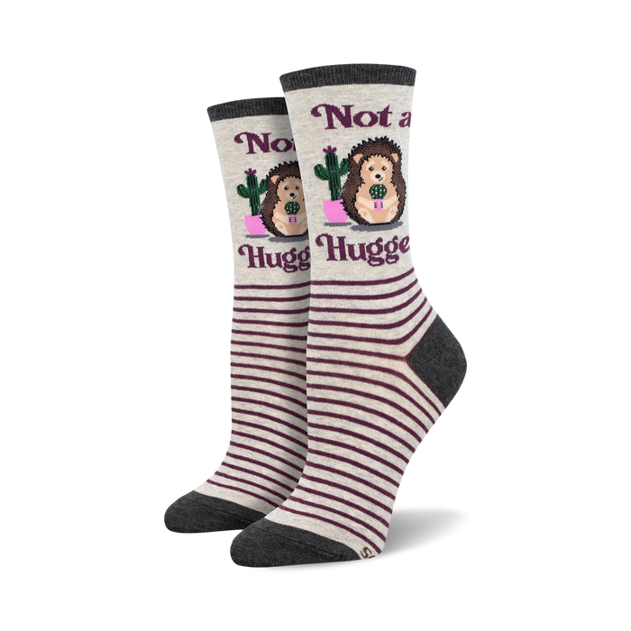 crew length gray socks with purple stripes feature porcupine in pink pot with green cactus. 'not a hugger' in purple.   }}