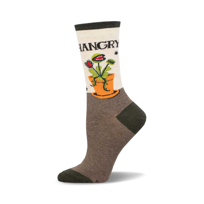 socks that are mostly brown with a white cuff and a white foot. the main feature of the socks is a of a venus flytrap with the word 'hangry' above it. }}