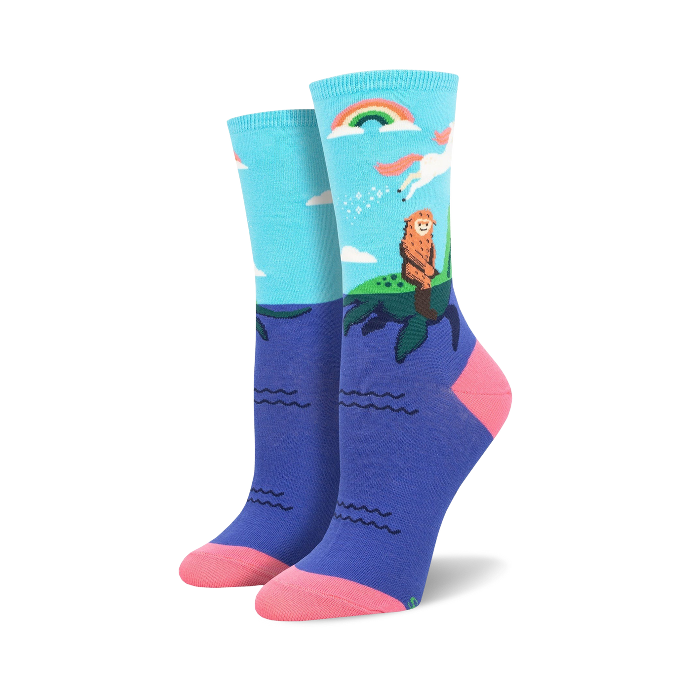 Women's crew socks in teal and purple featuring a Bigfoot watching a unicorn over a rainbow and ocean waves.
