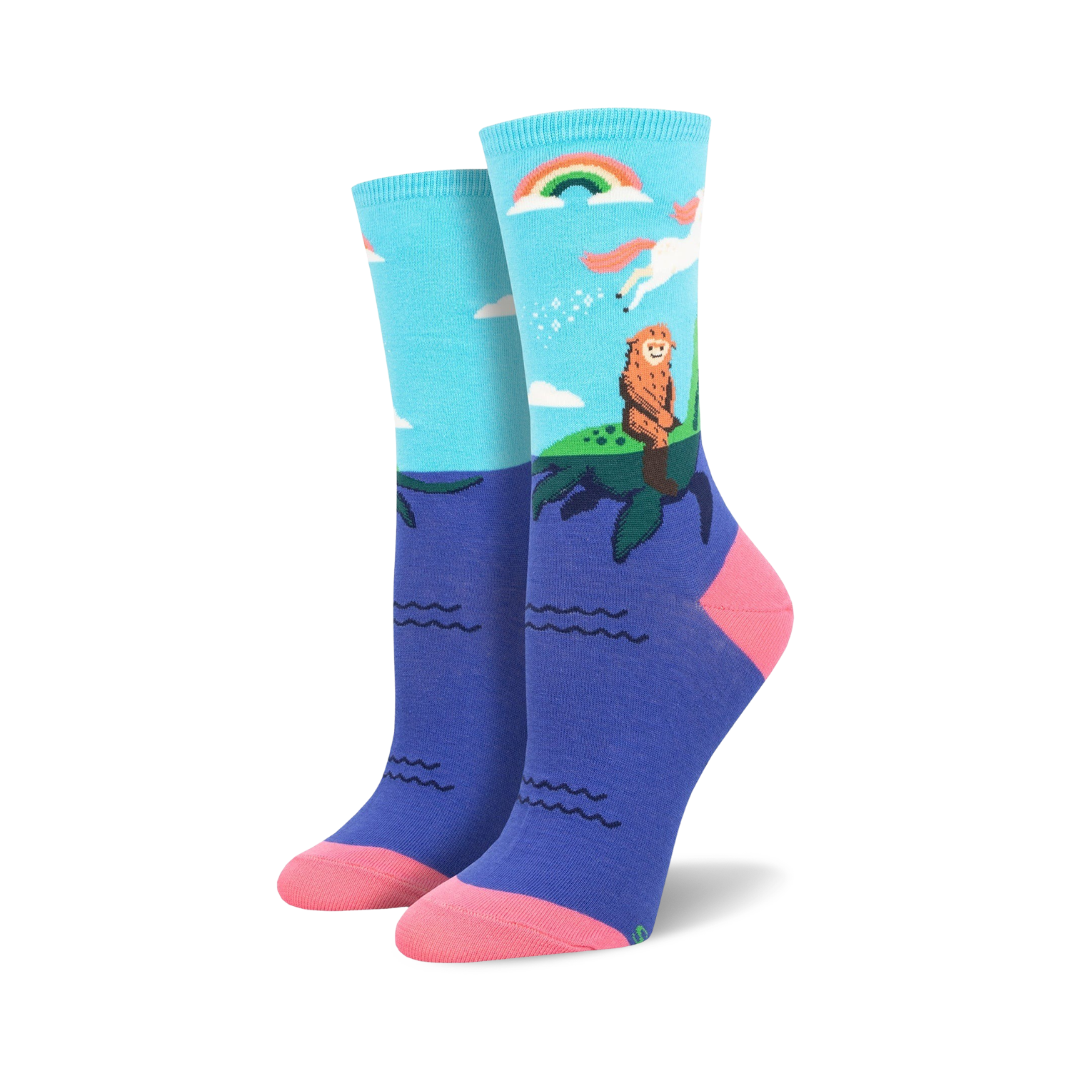 Women's crew socks in teal and purple featuring a Bigfoot watching a unicorn over a rainbow and ocean waves.