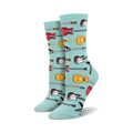 Pair of crew socks in teal, featuring a pattern of red, yellow, and brown guitars. 