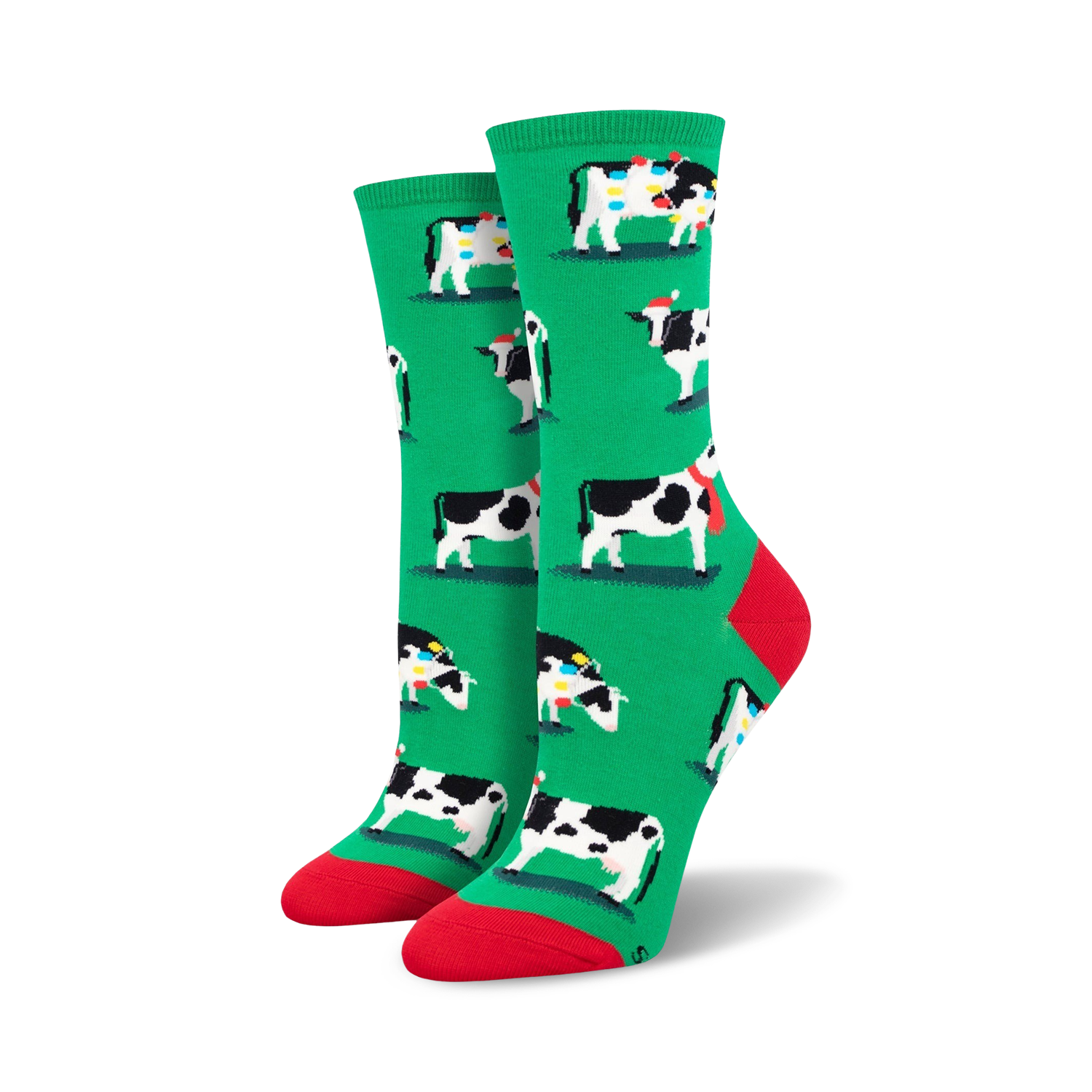 Pair of women's crew socks. Green background with a repeating pattern of black and white cows wearing Christmas hats and scarves.