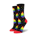 Pair of crew socks on black background.  Rainbow Christmas trees and colorful dots decorate the socks, which have red cuffs.
