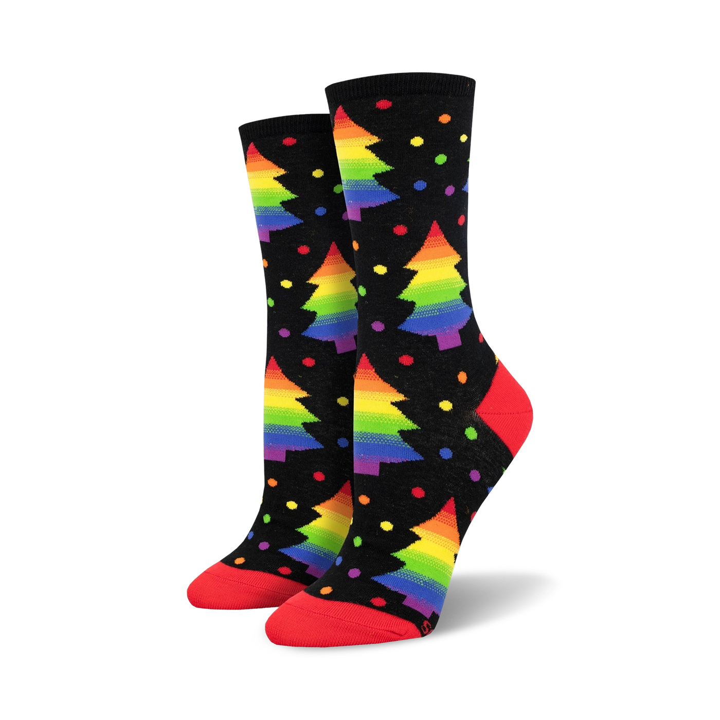 Pair of crew socks on black background.  Rainbow Christmas trees and colorful dots decorate the socks, which have red cuffs.