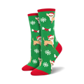 Crew socks in green with a festive design. Features Chihuahuas wearing Santa hats, snowflakes, and bones. Red and white accents.