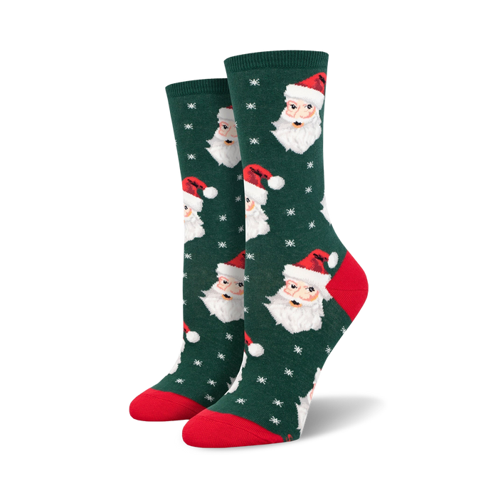 womens dark green crew socks featuring santa claus face with white snowflake pattern.    }}