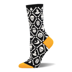 Black crew sock with orange heel and toe. White crossed bones form a lattice filled with skulls, pumpkins, bats, and ghosts.