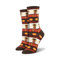 A pair of women's crew socks in brown, orange, and cream. The design includes pilgrim turkeys, pumpkins, and autumn leaves with the word 'Gobble'.