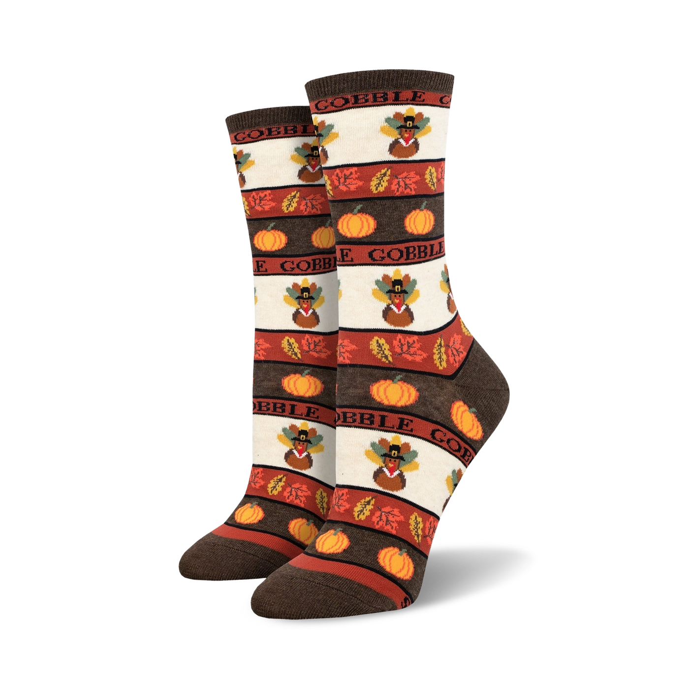 A pair of women's crew socks in brown, orange, and cream. The design includes pilgrim turkeys, pumpkins, and autumn leaves with the word 'Gobble'.