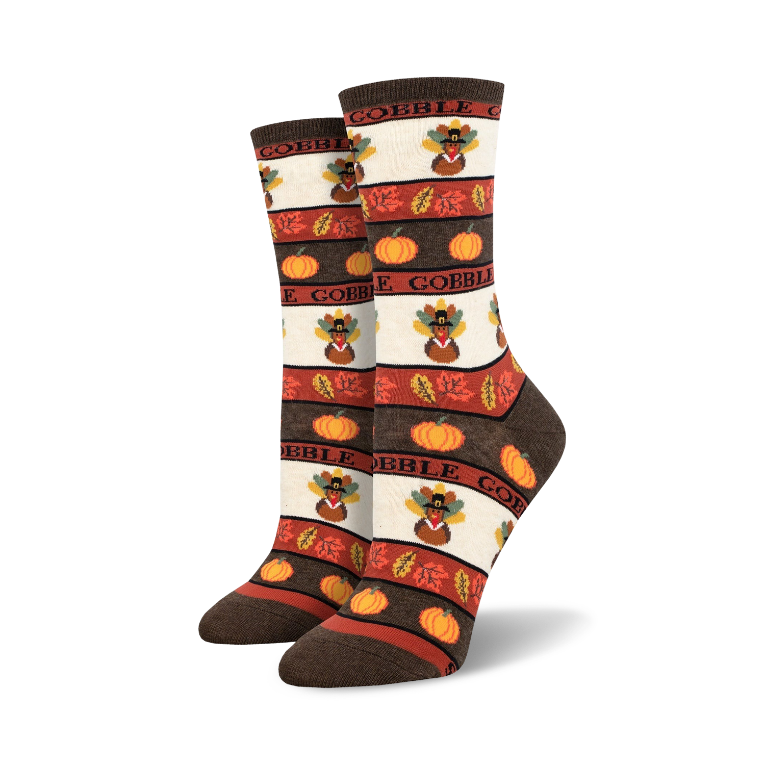 A pair of women's crew socks in brown, orange, and cream. The design includes pilgrim turkeys, pumpkins, and autumn leaves with the word 'Gobble'.