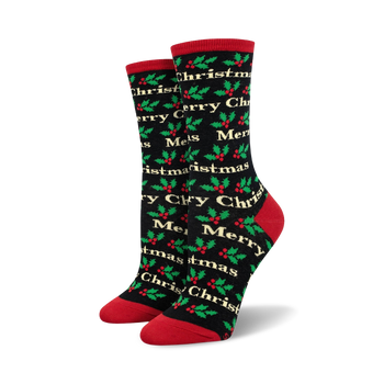women's black crew socks with christmas holly leaves and berries pattern and merry christmas script lettering. 