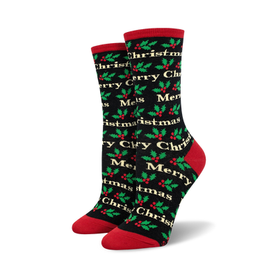 women's black crew socks with christmas holly leaves and berries pattern and merry christmas script lettering. 