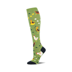 A single knee-high sock shown in profile. It's olive green with illustrated chickens, chicks, and eggs.  The toe and top are navy.