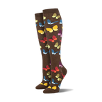 Pair of brown knee-high socks with a colorful butterfly pattern.  Butterflies in yellow, orange, blue, and purple.