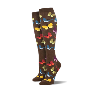 Pair of brown knee-high socks with a colorful butterfly pattern.  Butterflies in yellow, orange, blue, and purple.