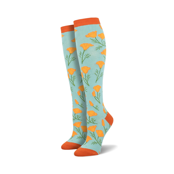 light blue knee high socks for women with all-over orange poppy pattern, green stems and leaves.  