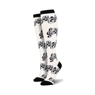   black treble clefs, eighth notes printed on white knee high womens tuning out music notes novelty dress socks. fun, soft, and made for women who love music.  