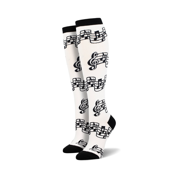   black treble clefs, eighth notes printed on white knee high womens tuning out music notes novelty dress socks. fun, soft, and made for women who love music.  