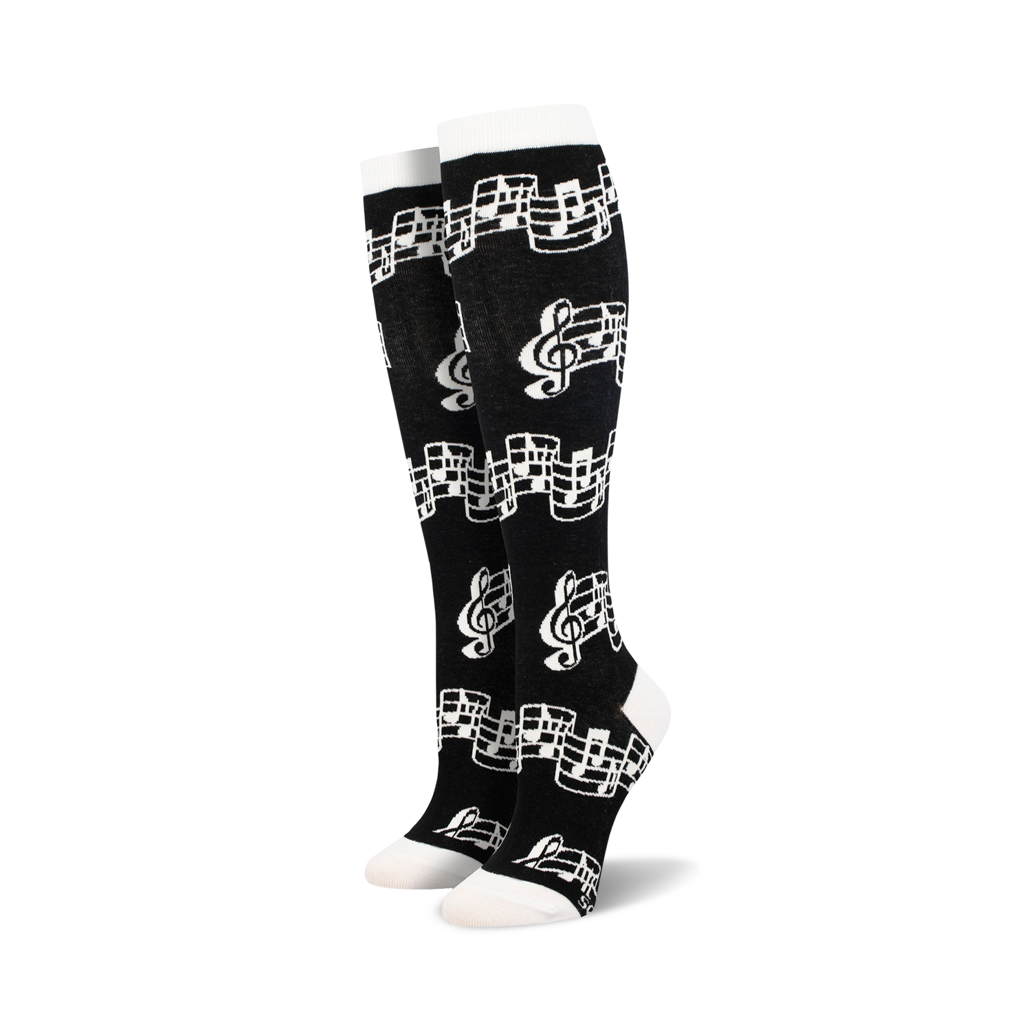 Close-up of black knee-high socks with musical notes pattern.