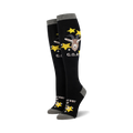 Pair of black knee-high socks with a goat graphic, yellow stars, and 'G.O.A.T.' text. Gray cuff.