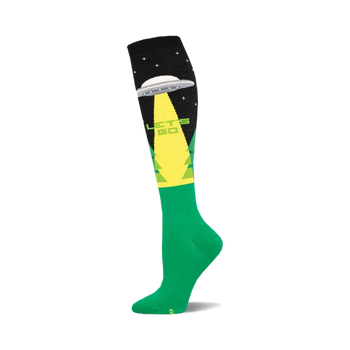 Knee-high green and black sock with a grey UFO, green light beam, "LET'S GO" text, and green trees on the design.