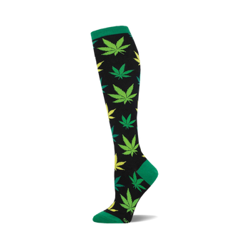 the herb garden socks are black with a pattern of green and yellow cannabis leaves.