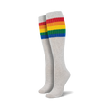 Pair of light gray knee-high socks with a vibrant rainbow striped cuff against a white background.