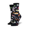 A close-up lifestyle shot showing the black Sushi socks on a model's feet.
