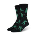 Pair of black crew socks featuring a repeating pattern of teal pixelated army men. Fun and playful design.