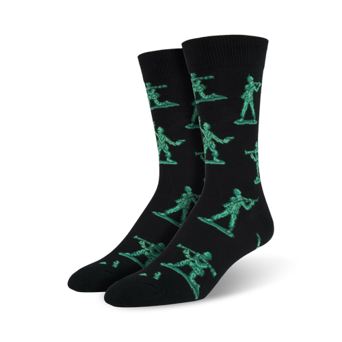 Pair of black crew socks featuring a repeating pattern of teal pixelated army men. Fun and playful design.