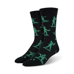 Pair of black crew socks featuring a repeating pattern of teal pixelated army men. Fun and playful design.