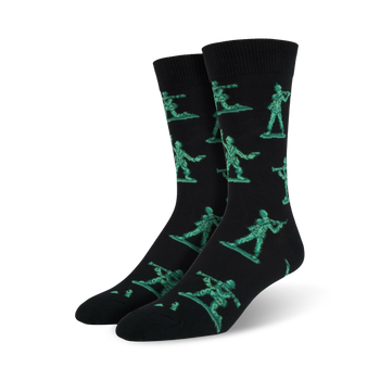 black crew socks for men featuring a pattern of green plastic army men holding guns.   
