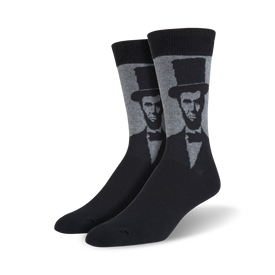 black socks with a light gray pattern of abraham lincoln's face on a dark gray toe, heel, and top.  