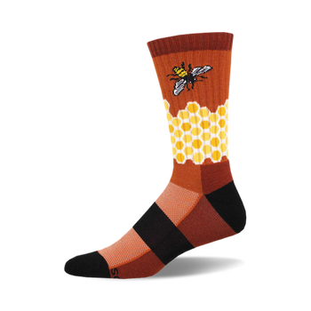 the home sweet honeycomb socks are orange, brown, and black. they have a honeycomb pattern with a bee on one side. socks that are made of a thin, breathable material.
