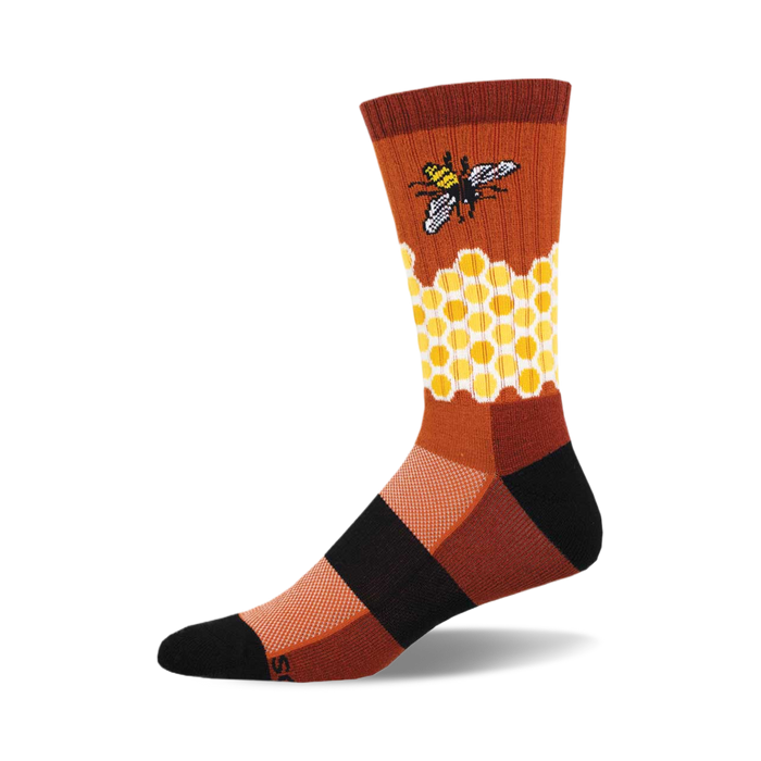 the home sweet honeycomb socks are orange, brown, and black. they have a honeycomb pattern with a bee on one side. socks that are made of a thin, breathable material. }}