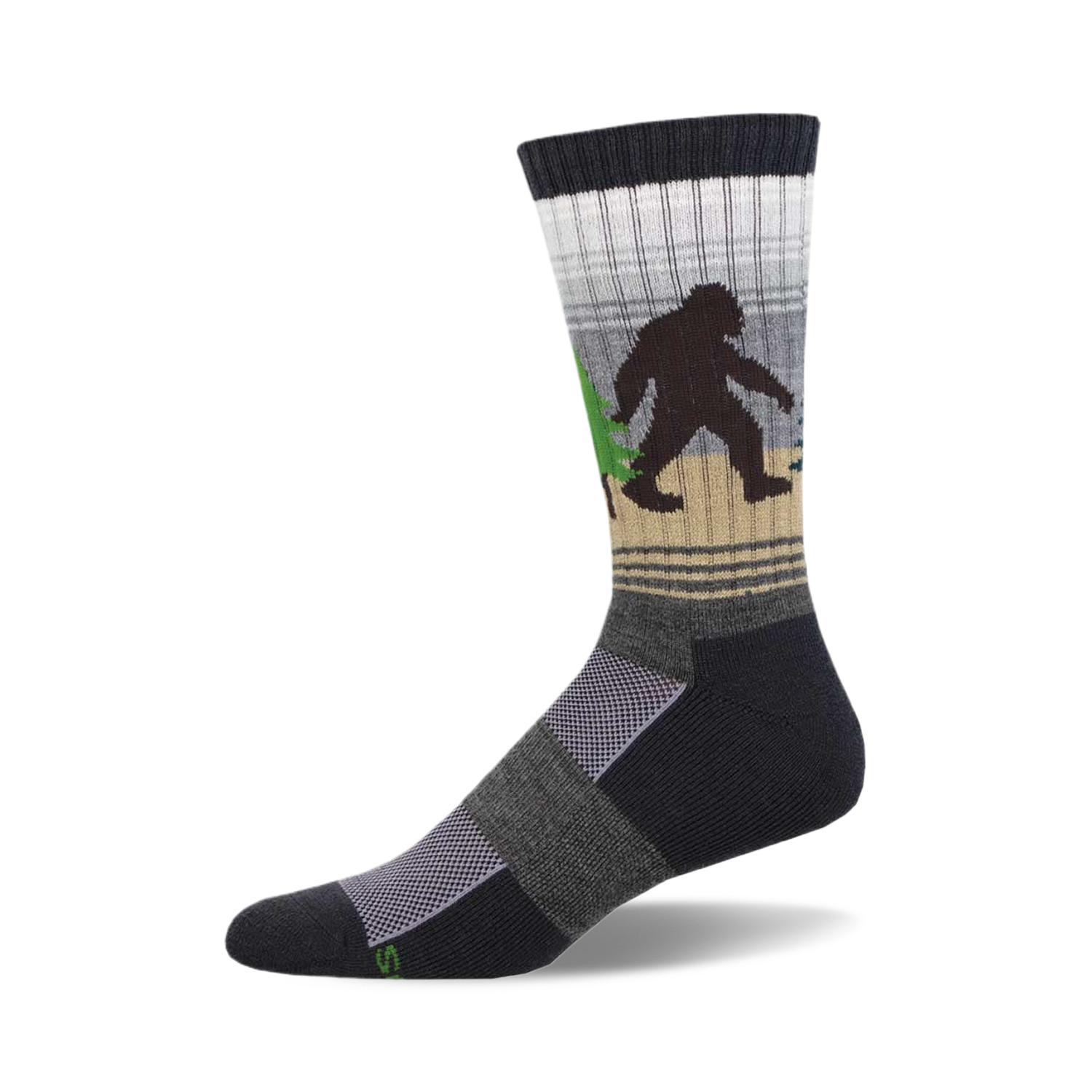 Crew socks in dark gray, beige, and white, featuring a Bigfoot walking through a forest.  Green trees and a subtle striped pattern.