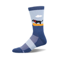 Crew socks in blue and light blue featuring a black labrador in a yellow canoe against a light blue sky background.