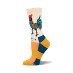 Cream crew socks with a folk art-style rooster in teal, orange, and navy.  The foot features teal and gold stripes.