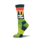 Crew socks in green, teal, and orange, featuring a retro camper van design against a sunset graphic with pine trees.