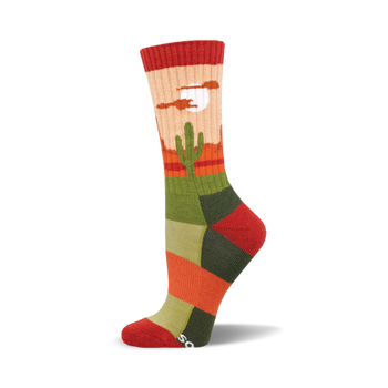 the sock has a pattern of cacti in a desert with mountains in the background. the colors are red, orange, yellow, green, and blue.