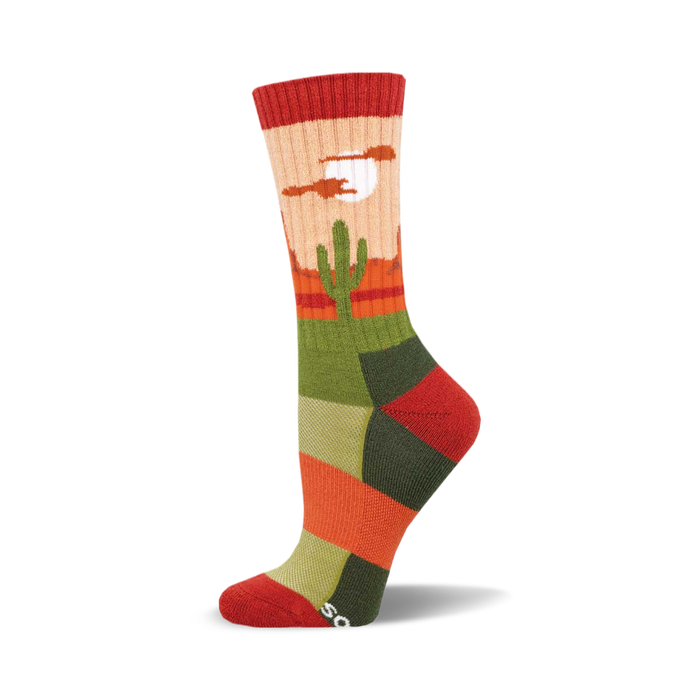 the sock has a pattern of cacti in a desert with mountains in the background. the colors are red, orange, yellow, green, and blue. }}