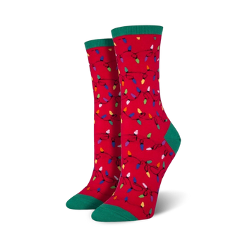 multicolored christmas lights adorn these festive red crew socks. green cuff with white line.  