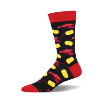 the crawfish boil socks are black with a red toe, heel, and top. socks that are covered in a pattern of red crawfish and yellow corn.