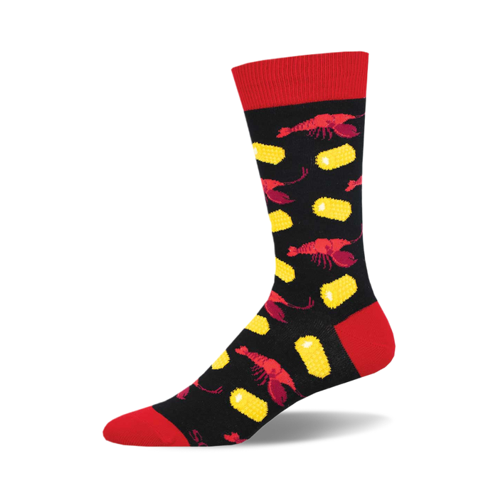 the crawfish boil socks are black with a red toe, heel, and top. socks that are covered in a pattern of red crawfish and yellow corn. }}