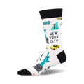 White crew socks with a black cuff, featuring pixel art of the Statue of Liberty, yellow cabs, and other NYC icons in teal and yellow.