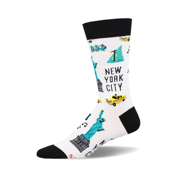socks that are white with a pattern of various new york city landmarks and symbols. there are images of the statue of liberty, the empire state building, a yellow taxi, a subway train, and a fire hydrant.
