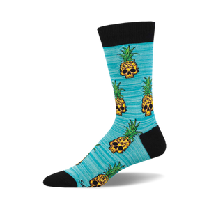 Crew socks in teal with a repeating pattern of pixelated pineapple skulls. Black cuff.