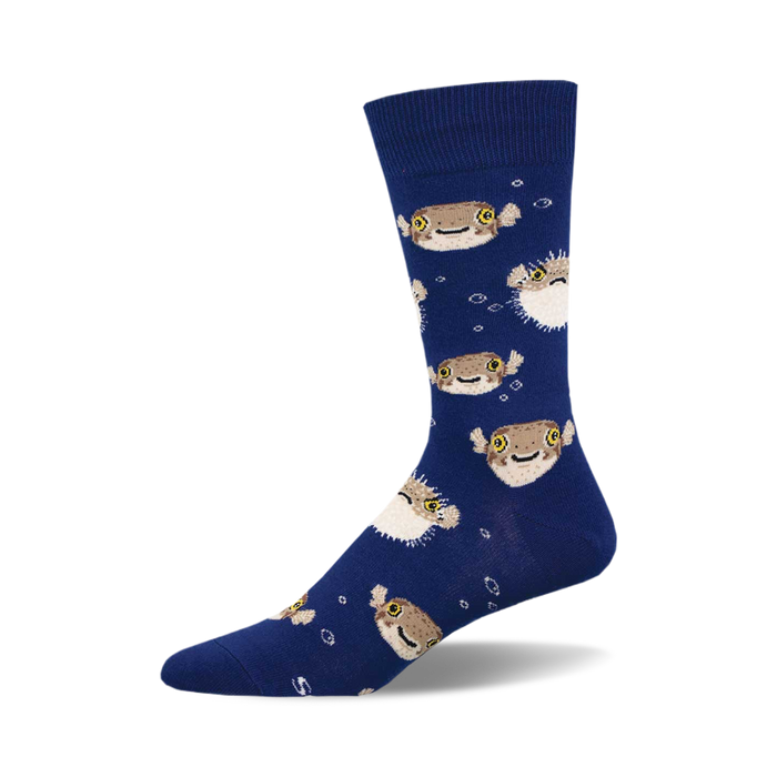 socks that are blue with a pattern of pufferfish. the pufferfish are brown and have yellow eyes. }}